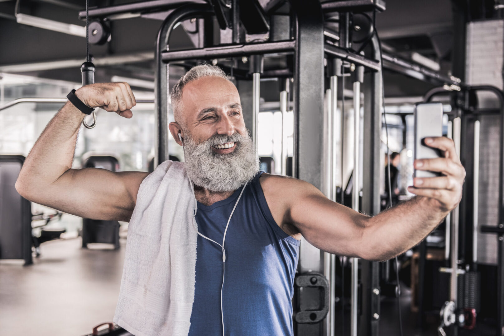 A man with headphones is doing some exercise.