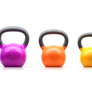 Three different colored kettlebells are lined up.