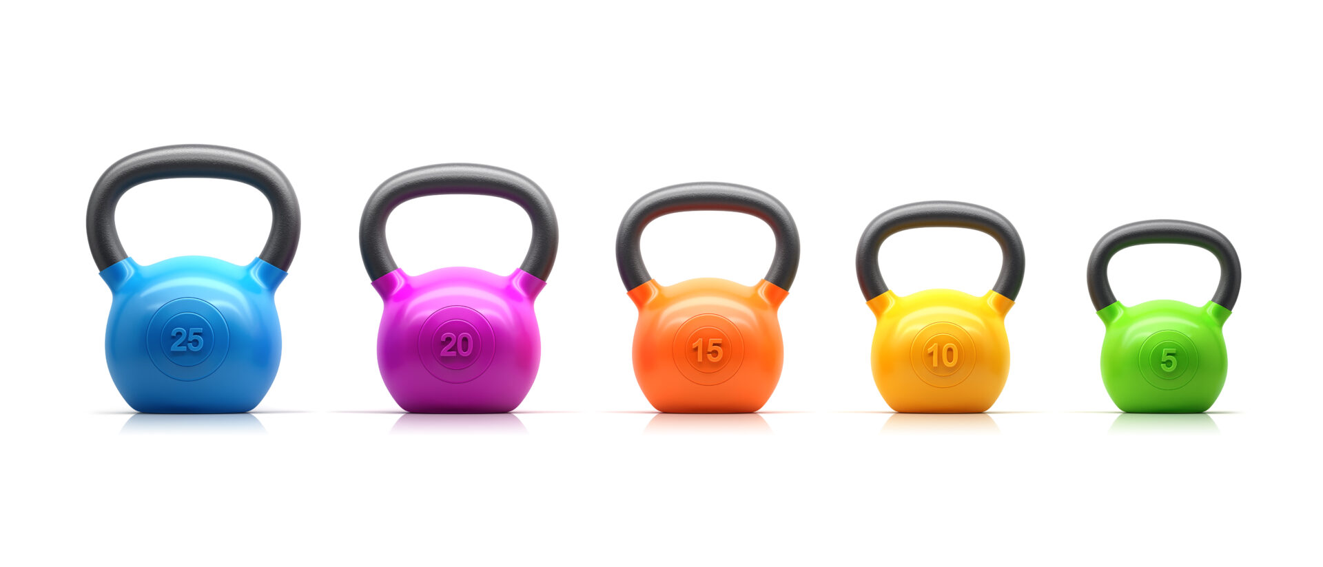 Three different colored kettlebells are lined up.